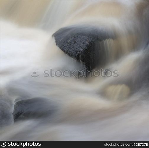 Fine art landscape detail image of water flowing over rocks