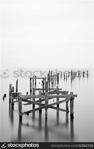 Fine art long exposure landscape of decayed pier