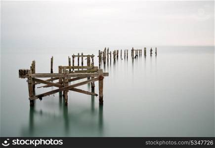 Fine art long exposure landscape of decayed pier