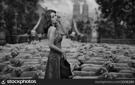Fine art photo - brunette as a shepherd in an urban scenery