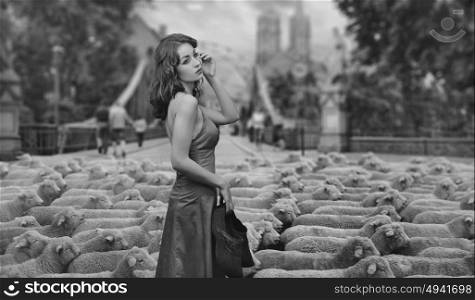 Fine art photo - brunette lady as a shepherd in an urban scenery