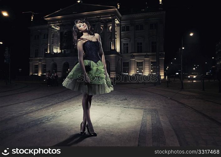 Fine art photo of a beautiful woman in front of a building