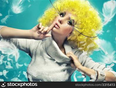 Fine art photo of a girl on the blue background