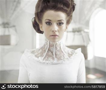 Fine art photo of a young fashion woman in a stylish interior