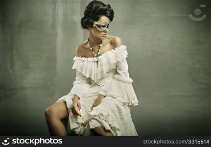 Fine art photo of a young woman wearing mask