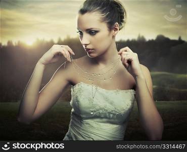 Fine art photo - young lady wearing a necklace of morning dew