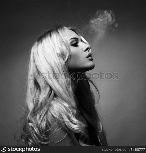 Fine art portrait of a beautiful lady smokes