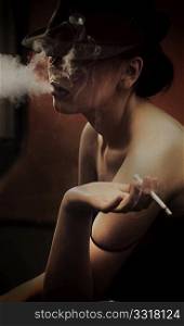 Fine art portrait of a beautiful lady with cigarette
