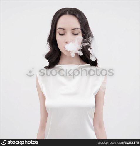 Fine art portrait of a beautiful lady with cigarette smoke