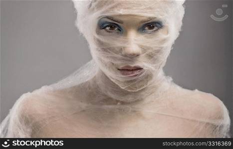 Fine art portrait of a young woman in bandage