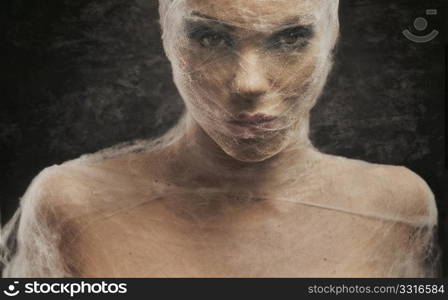 Fine art portrait of a young woman in bandage