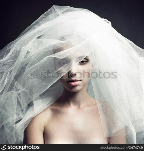 Fine-art portrait of elegant girl in veil