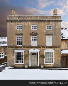 Fine Cotswold house in snow, Broadway, Worcestershire, England.