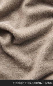 Fine grey cashmere texture close-up. Warm cashmere fabric as background, top view