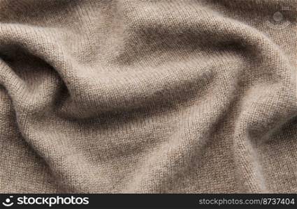 Fine grey cashmere texture close-up. Warm cashmere fabric as background, top view