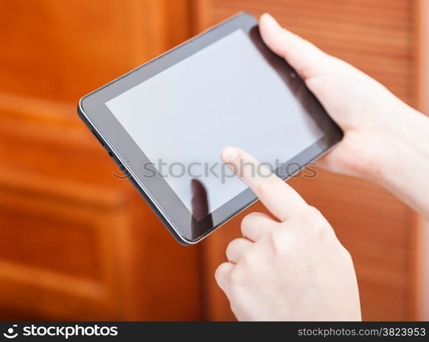 finger clicking tablet pc screen in office