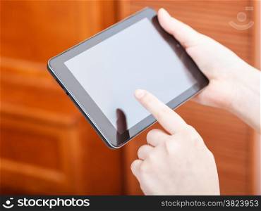 finger clicking tablet pc screen in office