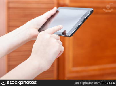 finger clicking touchpad screen in an office