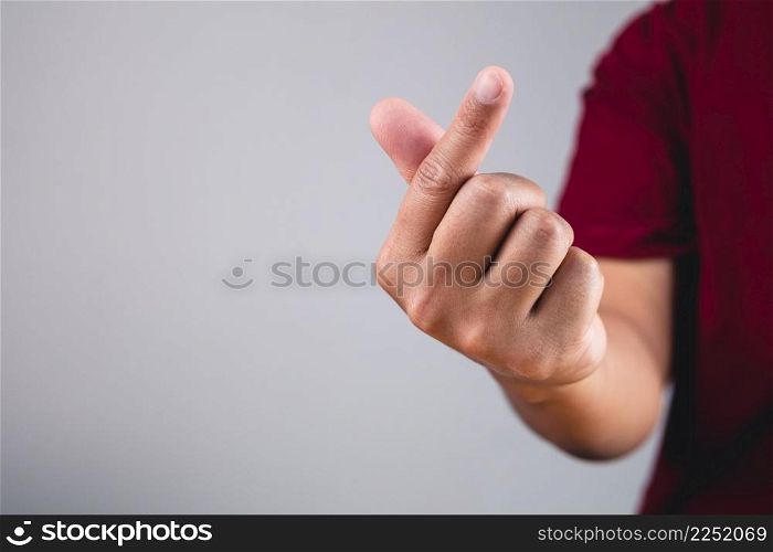 Finger heart in korean style. Sign of love isolated on white and grey background. Valentine&rsquo;s day concept.