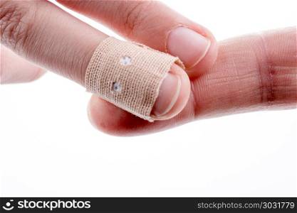 finger in white bandage. finger in white bandage on a white background