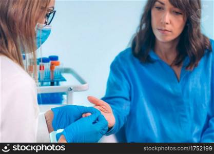 Finger Prick Blood Draw. Nurse Taking Blood S&le from Patient’s Finger