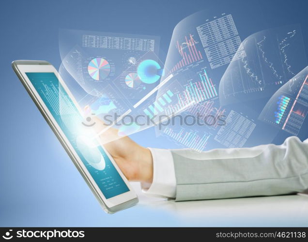 Finger touch. Close up image of human hand touching screen of tablet pc