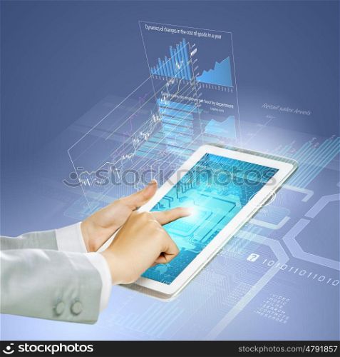 Finger touch. Close up image of human hand touching screen of tablet pc