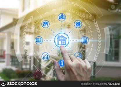 Finger touch with property investment icons over the Network connection on property background, Property investment concept. 