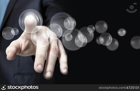 Finger touching icon. Close up of businessman hand touching icon on screen