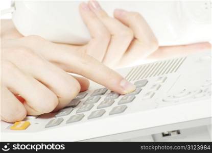 finger with white telephone keypad