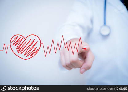 finger write red heart with the heart is a part of a cardiogram, Concept of medical examination.