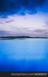 Finnish lake landscape shot at dawn with heavy postprocessing