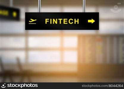 FINTECH or financial technology on airport sign board with blurred background and copy space