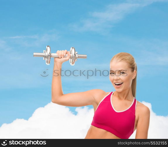 fintess, healthcare and dieting concept - young sporty woman with heavy steel dumbbell