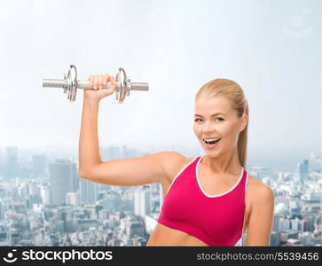 fintess, healthcare and dieting concept - young sporty woman with heavy steel dumbbell