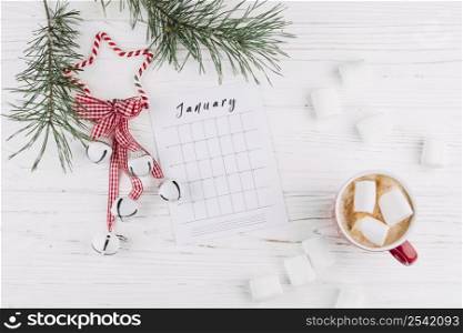 fir tree branches with calendar jingle bells