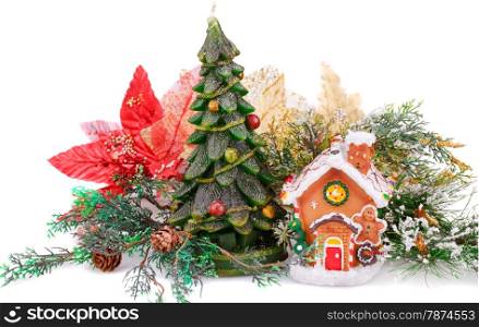 Fir tree candle, toy house and holly berry flower on white background.