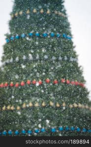 Fir tree decorated with colorful balls for Christmas time.