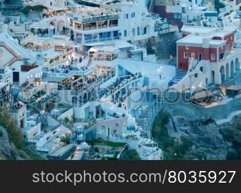 Fira at sunset. Santorini, Cyclades, Greece.. View of the town Fira in the night light. Santorini.