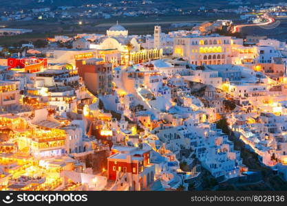 Fira, modern capital of the Greek Aegean island, Santorini, with Orthodox Metropolitan Cathedral at night, Greece