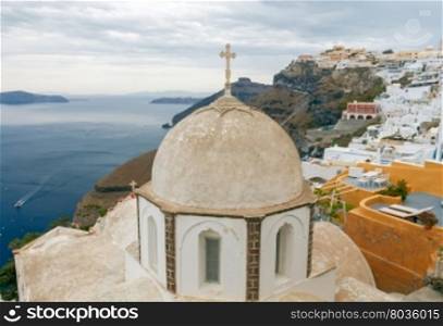 Fira. Traditional Greek church.. View of the Greek Christian church with a cross in the town Fira. Santorini. Greece.