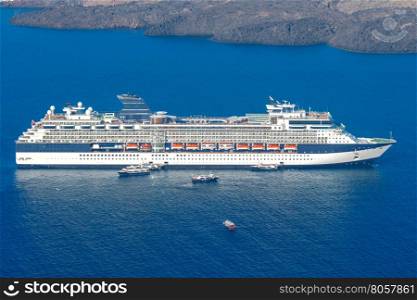 Fira. View of the old harbor.. Passenger ship in the old port of Fira early sunny morning. Santorini. Greece.