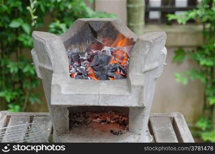 Fire burning charcoal in asian stove , for bbq