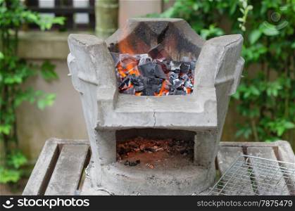 Fire burning charcoal in asian stove , for bbq