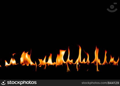 Fire flames on Abstract art black background, Burning red hot sparks rise, Fiery orange glowing flying particles