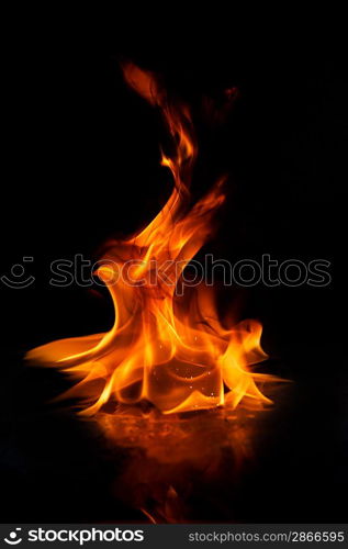 Fire flames reflected in water