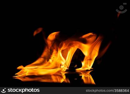 Fire flames reflected in water