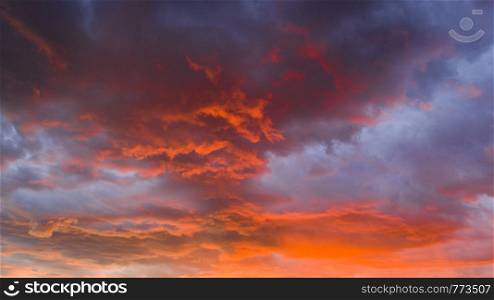 Fire Orange Sunset With Blue Cloud Background