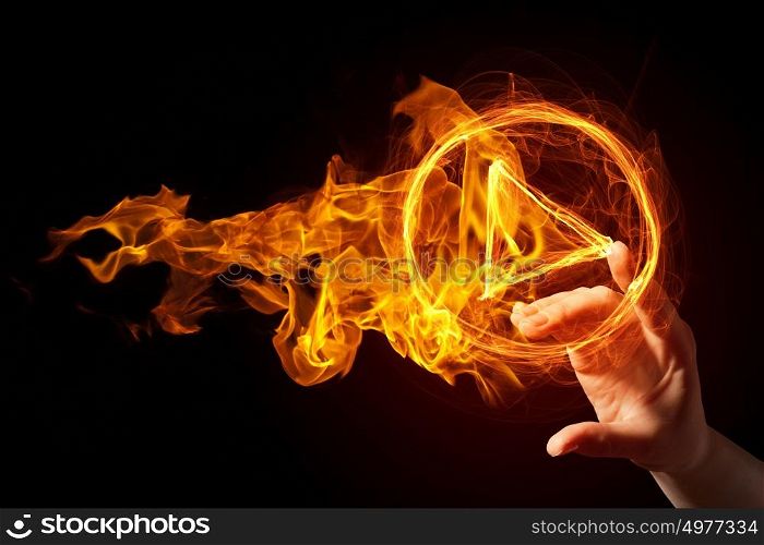 Fire play icon. Finger touch glowing fire play icon on dark background