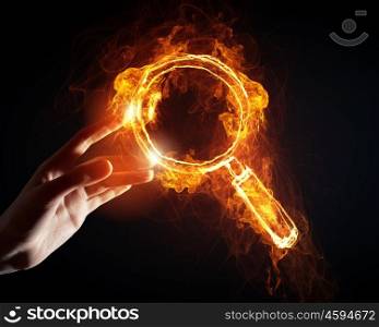 Fire search icon. Finger touch glowing light search icon on dark background